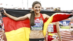 Gesa Felicitas Krause nach ihrem Sieg über die 3000 m Hürden bei den Europameisterschaften in Amsterdam © dpa Foto: Vincent Jannink